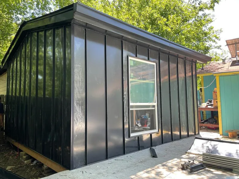 Black standing seam metal wall panels for Roof Inspection in Fern Park